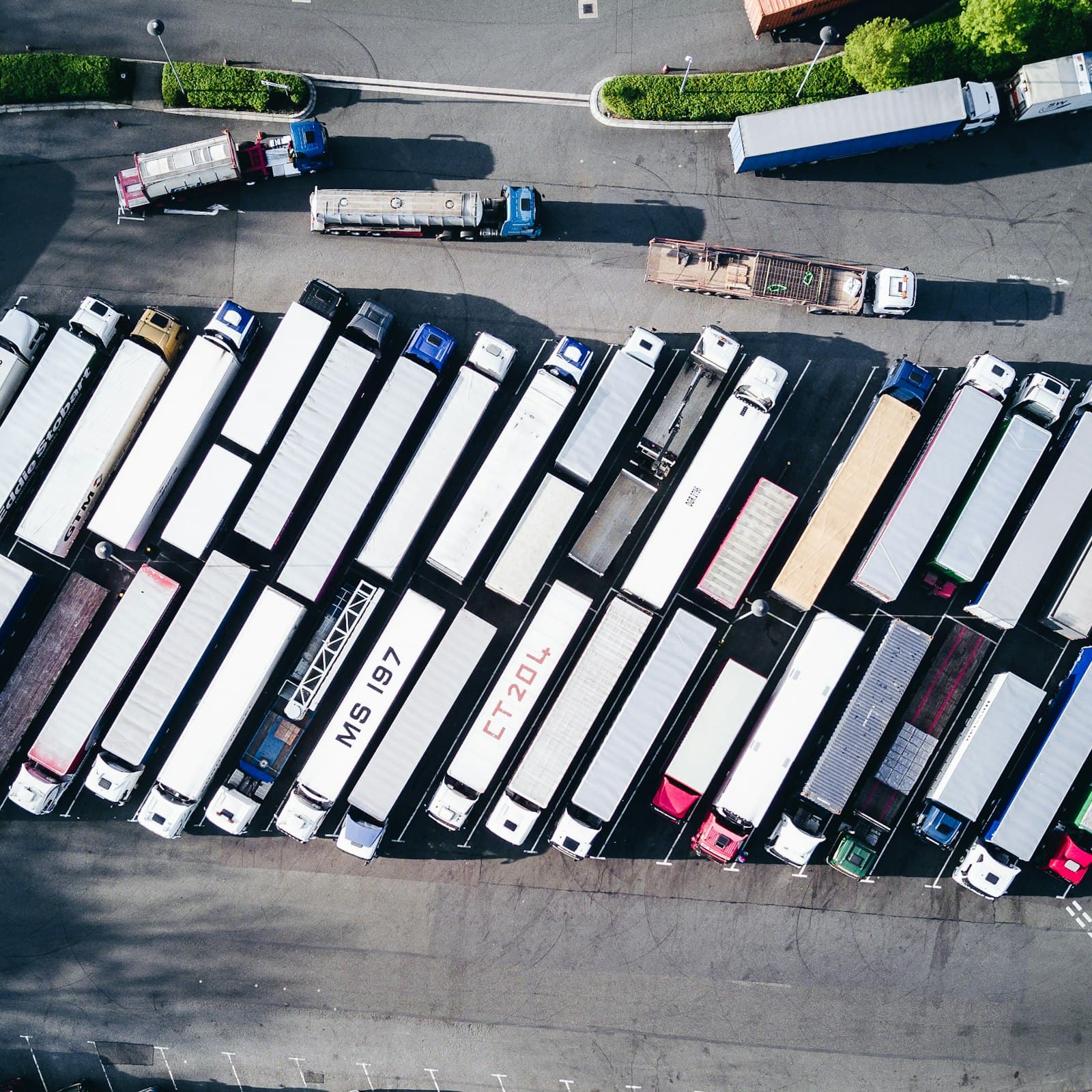 Aerial view of a fleet yard with rows of parked trucks